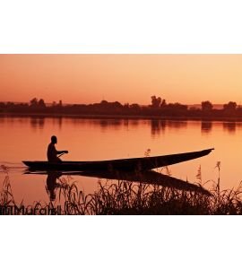 Canoe at sunset Wall Mural