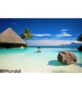 Infinity pool with artificial beach and ocean Wall Mural